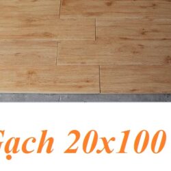 gach lat nen van gia go 20x100 mau vang